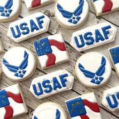 many decorated cookies with the words usaaf and an eagle on them are sitting on a table