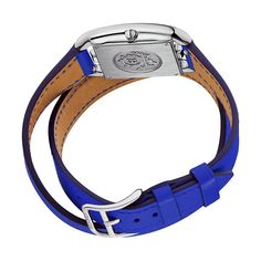 Hermes steel watch, 23 x 23 mm, opaline silvered dial, quartz movement, long interchangeable double tour strap in smooth electric blue calfskin Wrist size: 150-165 mm Size: small modelCase: steel, 23 x 23 mmAnti-glare sapphire crystalWater-resistant to 3 bar. Avoid all contact with water while wearing your Hermes leather watch.Dial: opaline silveredMovement: quartz, made in SwitzerlandFunctions: hour, minuteBracelet: smooth electric blue calfskin, interchangeable, wrap-around, long, steel pin bu Timeless Blue Rectangular Watch, Blue Rectangular Timeless Watch, Blue Rectangular Business Watches, Classic Blue Rectangular Watch Accessories, Rectangular Blue Quartz Watches, Luxury Adjustable White Gold Watches, Leather Watch With Bracelet Strap And Rectangular Dial, Silver Leather Watch Band With Rectangular Dial, White Gold Leather Watch With Diamond Hour Markers