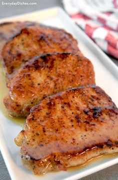 two pieces of chicken on a white plate