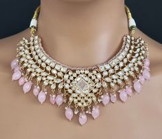 Pink Fine Kundan Indian Bridal necklace, Wedding necklace, Fine kundan jewelry, Pakistani Jewelry, Indian Jewelry, Bridal Jewelry Gold-plated foiled Kundan necklace set.  Regular Size And Adjustable Ships from California, USA Delivery in 2-5 business days in the USA. Other designs can be found here https://www.etsy.com/listing/1381240765/premium-quality-gold-plated-silver?click_key=e1a9e46c1ba3dcb2d7ddeb00610b709b7497bd62%3A1381240765&click_sum=5b5797e9&ref=shop_home_active_511&pro=1&frs=1&sts=1 Pink Temple Necklace For Wedding And Diwali, Kundan Bridal Necklace For Reception Diwali, Pink Kundan Temple Necklace For Wedding, Kundan Temple Necklace With Gota Work For Weddings, Bridal Necklace With Gota Work For Diwali Reception, Diwali Bridal Necklace With Gota Work For Reception, Gota Work Necklace For Diwali Reception, Cinderella Fashion, Indian Bridal Necklace