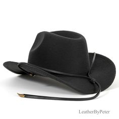 "Elevate your hat game with our exquisite Black Leather Strand Stampede String. Meticulously crafted from supple black leather, this stampede string exudes sophistication and rugged charm in equal measure. Designed with both style and functionality in mind, each strand features two sleek cotter pins at its ends, ensuring effortless attachment to your favorite hat while providing steadfast security. Adding a dash of rustic allure, two small bronze ox horns adorn the ends, infusing your headwear w Cowboy Accessories, Modern Hat, Cow Boy, Leather Slides, Red Heart, Hungary, Cowboy Hats, Caps Hats, Accessories Hats