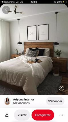 a bed room with a neatly made bed and two pictures on the wall above it