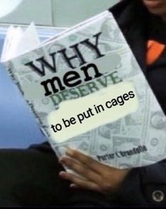 a man holding a book with the title why men serve to be put in cages