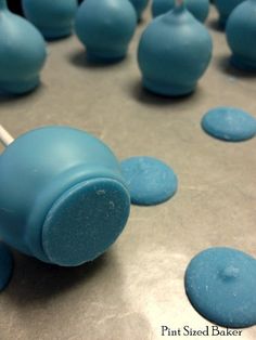 blue candy lollipops sitting on top of a table