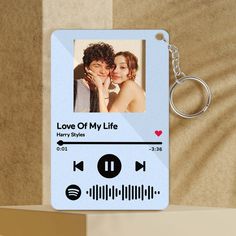 a keychain with an image of a couple on it