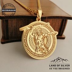 a gold necklace with an image of jesus on it