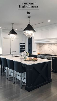 an instagram page with black and white kitchen furniture in the center, chandelier above island