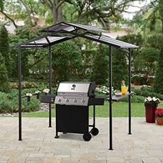 an outdoor grill and gazebo on a patio