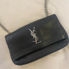 Saint Laurent Grain De Poudre Monogram Toy West Hollywood Fold-Over Bag Black Can Be Worn As Crossbody Or Clutch If You Just Tuck In The Straps Fits Phone, Cards, Cash, Lip Gloss, And Keys. Perfect For The Club Or Other Place Where The Are Bag Size Restrictions. Saint Laurent West Hollywood Bag, Foldover Bag, Saint Laurent Bags, Phone Cards, Saint Laurent Bag, West Hollywood, The Club, Lip Gloss, Saint Laurent