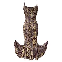 Roberto Cavalli - This gold and burgundy frayed dress has a certain je ne sais quoi about it. The sexy, rustic dress is made out of two layers of delicate silk fabric. The outer layer of gold and burgundy print and the inner lining is Roberto Cavalli signature leopard print. This is a slip on dress and fastens in the back with a boned lace up corset and black ties. The dress fabric is frayed throughout giving it that mysterious sexy rustic feel. This dress appears to have been a runway dress. Th Archival Fashion, Frayed Dress, Vintage Roberto Cavalli, 2004 Fashion, Rustic Dress, Robert Cavalli, Rustic Dresses, Roberto Cavalli Dress, Prom 2024