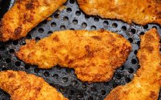 fried chicken pieces in a frying pan