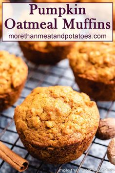 pumpkin oatmeal muffins cooling on a wire rack with cinnamon sticks