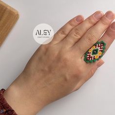 I made this wonderful ring(NIJER) with the highest quality Japanese miyuki beads. I am always careful and attentive while producing our products. And of course, we don't forget to add our love. ❤ Make yourself and your loved ones happy with this bracelet prepared with love and effort. ❤ WHAT IS MIYUKI BEAD? The small size of Miyuki beads, the equal size of each bead, their smooth cut and quality make the jewelry made with these beads unique. Jewelry made with Miyuki beads looks neater and appeal Handmade Multicolor Bohemian Crystal Ring, Green Beaded Rings For Gifts, Green Beaded Rings For Gift, Gift Colorful Beaded Round Rings, Bohemian Beaded Rings As Gift, Colorful Beads Ring Jewelry Gift, Colorful Beaded Ring Gift Jewelry, Colorful Beaded Ring Gift, Bohemian Rings With Tiny Beads As Gift