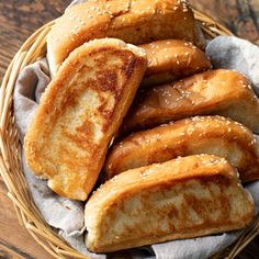 bread sticks in a basket with sesame seeds