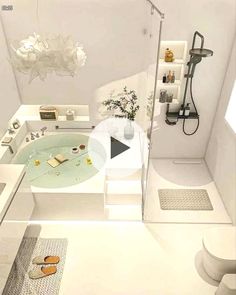 a bathroom with a bathtub, toilet and sink in it's center area