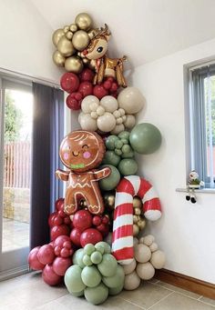 a tall christmas tree made out of balloons