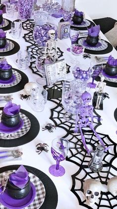 the table is decorated with purple and black decorations