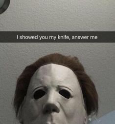 a creepy mask with the words i showed you my knife, answer me