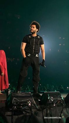 a man standing on top of a stage