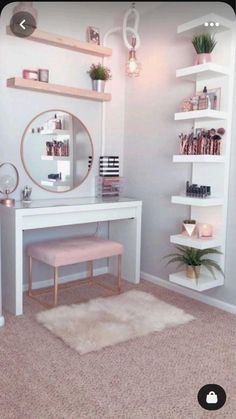 a white desk with a mirror, shelfs and plants on it in a room