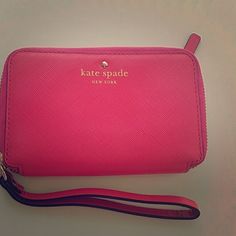 Kate spade wallet clutch Pink kate spade leather clutch with cream leather inside. Never used. So in love but sadly it doesn't fit my iPhone 6 with a case on it. This will fit the iPhone 6 when it does not have a case on it. kate spade Bags Clutches & Wristlets Kate Spade Rectangular Travel Clutch, Kate Spade Rectangular Clutch For Travel, Rectangular Kate Spade Clutch For Travel, Compact Kate Spade Wallets For Travel, Kate Spade Pink Wallet For Everyday Use, Kate Spade Bags With Card Slots For Gift, Kate Spade Travel Wallet With Zipper Closure, Kate Spade Travel Wallets With Zipper, Pink Kate Spade