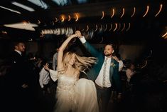 a bride and groom dancing at their wedding reception