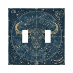 a light switch cover with an animal's head in the center and stars on it