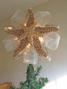 a starfish hanging from the ceiling with lights on it's head and bottom