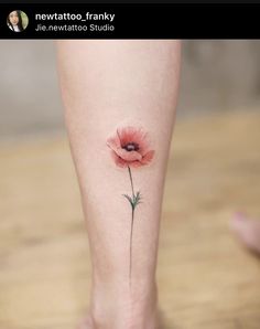 a single pink flower on the side of a woman's right leg with her left foot