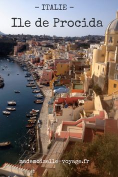 an aerial view of a harbor with boats in the water and buildings on either side