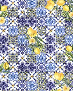 a blue and white tile pattern with lemons on the vine in front of it