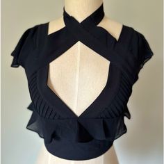 Nasty Gal Black Ruffle Zip-Up Gunmetal Black Back Zipper Ruffle Shoulders And Neckline Nwot Clasp Closure At Neck, One Became Detached As I Was Dressing The Mannequin, But I Have It. Will Try To Get It Sewed On! Size Xs Goth Cleavage Black Cropped Ruffle Crop Top, Black Ruffled Crop Top, Fitted Ruffled Crop Top For Evening, Black Ruffled Crop Top For Party, Black Ruffled Crop Top For Night Out, Elegant Black Ruffled Crop Top, Elegant Black Crop Top, Fitted V-neck Crop Top With Ruffles, Edgy Fitted Top With Ruffles