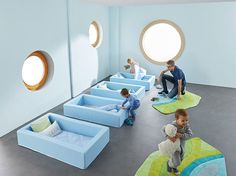 children playing with their toys in the playroom at an airport or cruise ship terminal