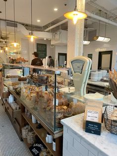 a bakery filled with lots of bread and pastries