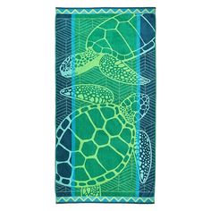 a beach towel with sea turtles on it