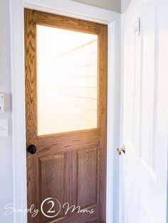 a wooden door with a window in it