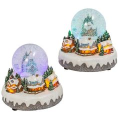 two snow globes sitting on top of each other