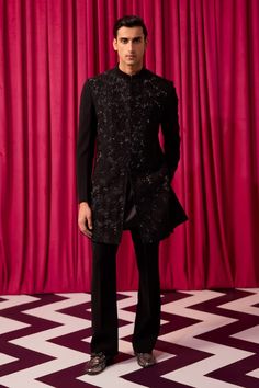 Black sherwani with cutdana embroidery in geometric pattern. Paired with kurta and pant. - Aza Fashions Designer Nehru Jacket With Chikankari Embroidery For Party, Fitted Sherwani With Chikankari Embroidery For Party, Designer Kurta For Eid Party, Black Sherwani With Chikankari Embroidery For Party, Designer Kurta With Chikankari Embroidery For Party, Black Party Sherwani With Chikankari Embroidery, Black Chikankari Embroidery Sherwani For Party, Black Bandhgala With Chikankari Embroidery For Party, Eid Party Bandhgala With Chikankari Embroidery