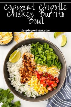 a bowl filled with chicken, rice and vegetables next to cilantro limes