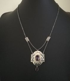 "A beautiful example of the Arts and Crafts necklaces c1900 created by Murrle Bennett, the Anglo German company, who mainly sold through Liberty & Co of London. This is a beautiful example, as it ticks so many boxes. In original condition, tick- stones both perfect, tick - original chains, tick - original toggle fastener, tick - gold mounts to the two amethysts, tick - fully signed as  Murrle Bennett piece with clear MBo and 950 stamps, tick and finally, in excellent condition, tick! A lovely necklace, which shows both of the man types of chain used by Murrle Bennett in these A&C pieces. The elongated links section runs from the spacers on each side, up to the toggle fastener. The smaller links chain is doubled in festoon-style from the spacers down to the main pendant. Just beautiful! The Silver Faceted Amethyst Necklace, Formal Multi-stone Amethyst Necklace, Formal Amethyst Multi-stone Necklace, Silver Amethyst Necklace With Faceted Details, Antique Agate Hand-strung Necklaces, Gold Collar, Lovely Necklace, Hammered Silver, Ticks