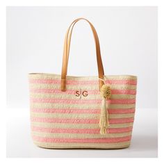 Take summery nautical style wherever your roam with this roomy straw bag. Designed for all your essentials for sunbathing on the sand or lazing by the lake, this sophisticated tote is equally at home in town as an everyday carryall. Crocheted from alternating colors of paper straw for a striped design, with a pom pom tassel and vegan leather handles for comfortable toting. Add a custom monogram to make it your own.    21"w x 6"d x 13"h  Handle drop: 9.5"  100% paper; vegan leather (polyurethane) Beachy Sand-colored Beach Bag With Braided Handles, Beachy Sand-colored Straw Bag, Pink Straw Tote Bag, Spring Vacation Crochet Bag With Handles, Straw Beach Bag With Adjustable Strap For Shopping, Chic Basket Beach Bag For Travel, Pink Straw Shoulder Bag For Summer, Chic Travel Beach Bag Basket Shape, Pink Straw Shopping Bag