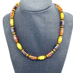 Add A Touch Of Vintage Class To Your Jewelry Collection With This Beautiful Multicolored Amber Necklace. The Necklace Features Barrel Shaped Amber Beads With Shades Of Orange Yellow And Brown Creating A Unique And Interesting Look. Measuring 17 Inches In Length And Fastening With A Barrel Clasp, This Necklace Is Perfect For Adding A Pop Of Color To Any Outfit. Make A Statement With This Beautiful Necklace Today! Cat. 2169 Yellow Single Strand Beaded Necklace As Gift, Yellow Single Strand Necklace For Jewelry Making, Luxury Amber Necklace With Colorful Beads, Amber Multi-strand Beaded Necklaces For Jewelry Making, Faceted Amber Necklace, Luxury Hand-strung Amber Beaded Necklaces, Elegant Multi-strand Amber Necklace, Amber Necklace, Amber Beads