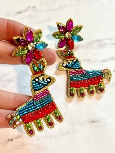 Celebrate Cinco de Mayo in Style with Our Vibrant Beaded Mexican Restaurant Piñata Earrings Get ready to fiesta with our stunning Cinco de Mayo Beaded Mexican Restaurant Piñata Earrings! Handcrafted with care and bursting with color, these earrings are the perfect accessory to add a festive touch to your celebration. Fiesta Vibes: Embrace the spirit of Cinco de Mayo Beaded Mexican Restaurant Piñata Earrings with our colorful margarita beaded earrings. Each bead is intricately woven to create a s Mexican Earrings Handmade, Mexican Style Earrings, Tequila Restaurant, Bohemian Beaded Embroidered Earrings For Festivals, Mexican Seed Bead Earrings, Oaxaca Earrings, Seed Beaded Earrings, Mexican Restaurant, Trendy Accessories