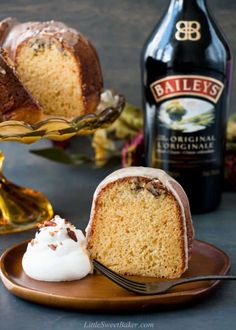 bailey's irish cream bundt cake on a plate with a fork and bottle in the background