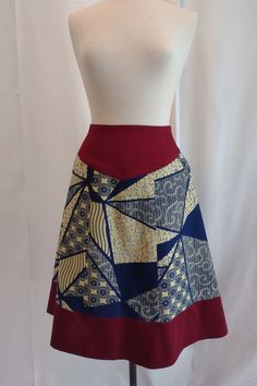 "NEW/UNWORN SAMPLE: high waisted skirt made of butter yellow and navy african print fabric with dark red contract yoke, side pockets and dark red contrast band at hem, princess seams create fit and flare shape, center back invisiblezipper.  Waist is self faced with yoke fabric,  skirt is unlined, all seams are professionally serged, with blind hem. waist: 28\" hip: 42\" center back length: 26 1/2\" NOTE: measurements are garment measurements, NOT body measurements.  Because these are sample garments they generally do not fit into a traditional size chart.  Often there is additional fabric in the seams to allow for alterations.  I am happy to offer more detailed measurements for serious inquiries in hopes of achieving your best fit." Skirt With Yoke, Fashion Dream Job, Blind Hem, Fabric Skirt, Butter Yellow, African Print Fabric, Princess Seam, Brushed Cotton, Full Skirt