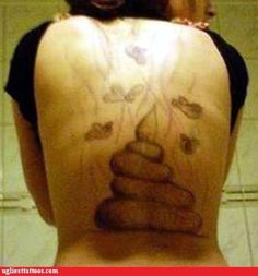 the back of a woman with tattoos on her body