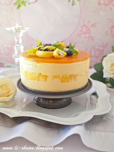 a cake on a plate with flowers in the background