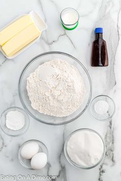 the ingredients to make this recipe include eggs, butter, and flour on a marble countertop