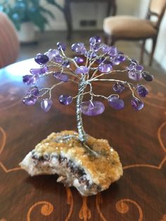 I handmade this Gemstone Tree of Life with genuine amethyst stones for the leaves & silver wire for the trunk & branches & a genuine natural sparkling Citrine Druzy Rock for the base. Amethyst brings such peaceful & calming loving vibes and Citrine brings much abundance. 💜 Height of whole thing is about 4 inches **you get the exact piece shown in the photos. It is a one of a kind. 😊 I tried to take pics in different lighting. These stones have such great healing properties....I hope it will br Lavender Amethyst Crystals As A Gift, Lavender Amethyst Crystals For Gift, Purple Mineral Crystal For Jewelry Making, Handmade Spiritual Tumbled Crystals, Handmade Spiritual Amethyst Gemstones, Handmade Lavender Crystals For Spiritual Use, Handmade Lavender Spiritual Crystals, Unique Purple Amethyst Crystals, Handmade Lavender Crystals As A Gift