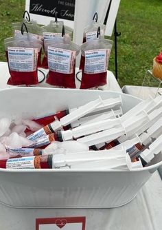 a bucket full of toothbrushes sitting on top of a table